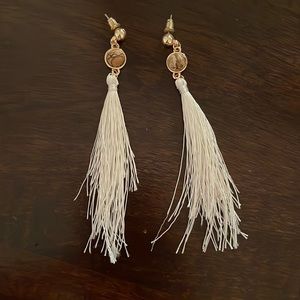 White + gold feathered dangly earrings from Uncommon James, only worn once